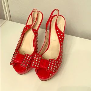 Red peep toe heels with bow